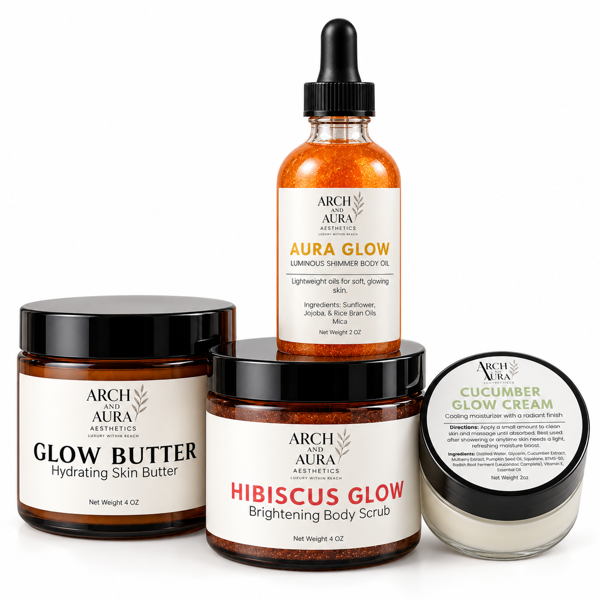 Four skincare products from Arch and Aura Aesthetics arranged together on a white background: Glow Butter, Hibiscus Glow Brightening Body Scrub, Aura Glow shimmer body oil, and Cucumber Glow Cream.